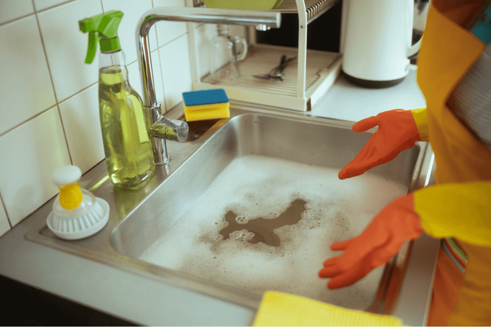 Grease and food waste buildup in Dubai kitchen drain pipes - common blockage causes